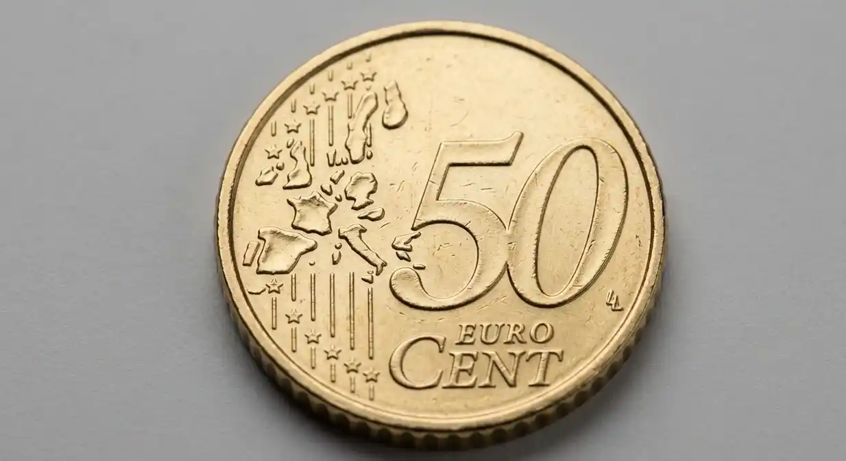 Close-up of a 50 euro cent coin with visible grading marks